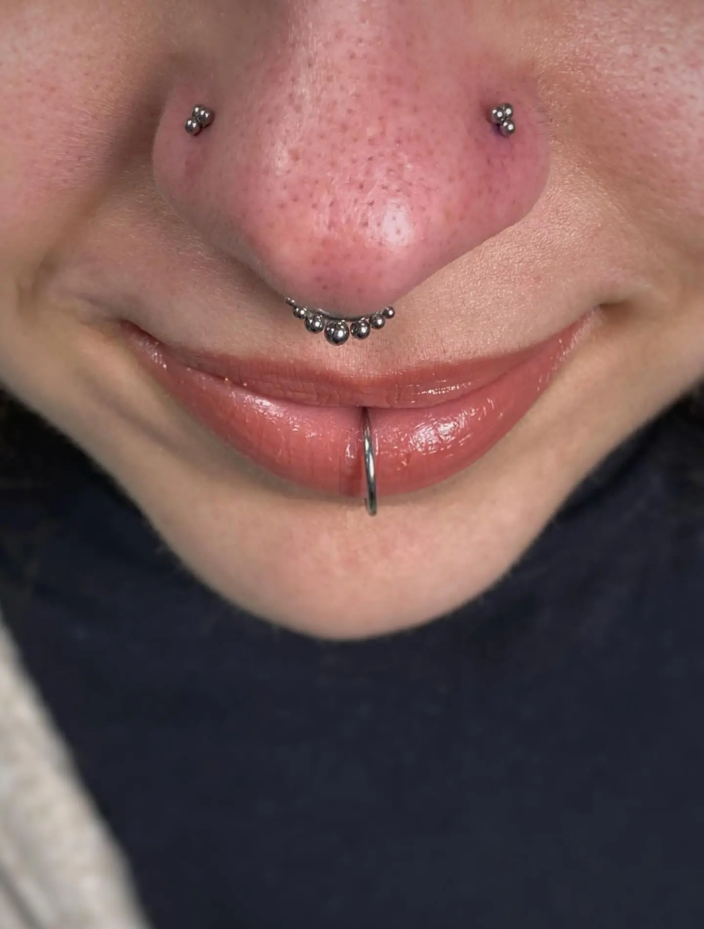 Symmetrical nostril septum labret piercings